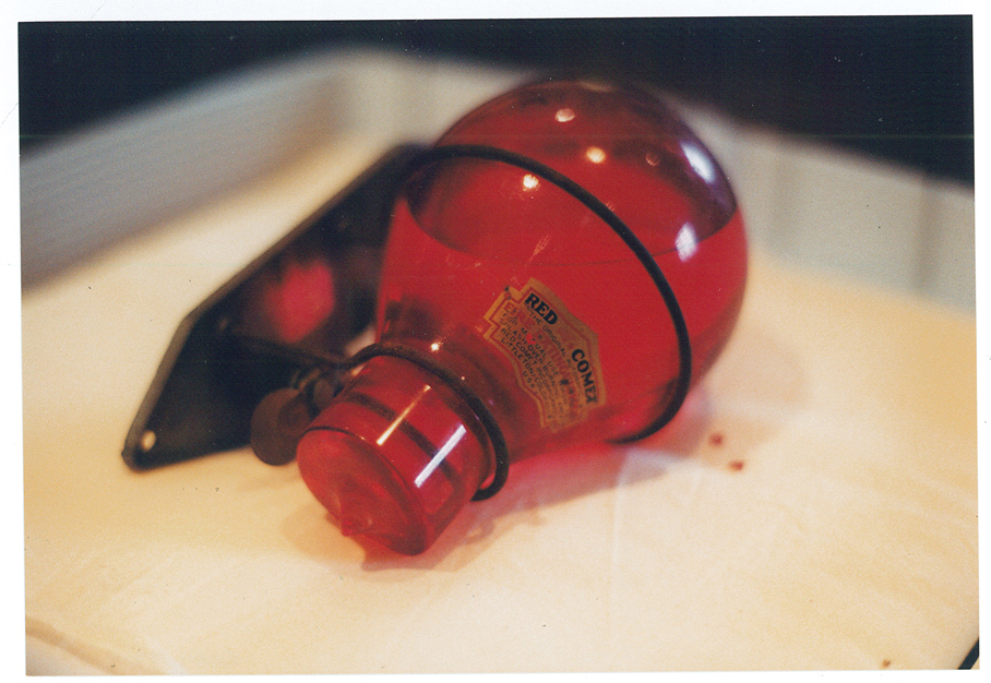 Red Comet fire extinguisher offered to the Morrison County Historical Society for its collections. Because of the chemical inside, MCHS couldn't accept it, but took photos before returning it to the donor. Photo by Mary Warner, 2001.