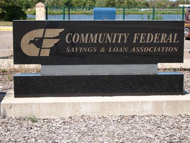 http://morrisoncountyhistory.org/museumpics/CFSL25.jpg Community Federal Savings & Loan granite sign behind the building. This sign was not removed when the institution changed from Community Federal to Home Savings. Photo by Mary Warner, August 28, 2012.