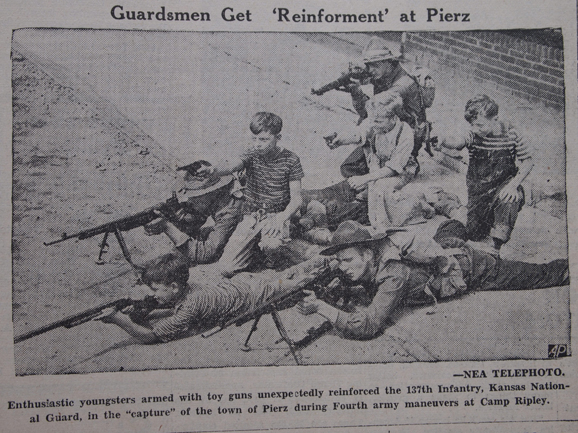 http://morrisoncountyhistory.org/museumpics/Miscellaneous%20012a.jpg Local boys from Pierz, MN, assisting members of the Kansas National Guard (137th Infantry) during U.S. Army war games hosted by Camp Ripley, August 16, 1940, Little Falls Daily Transcript.