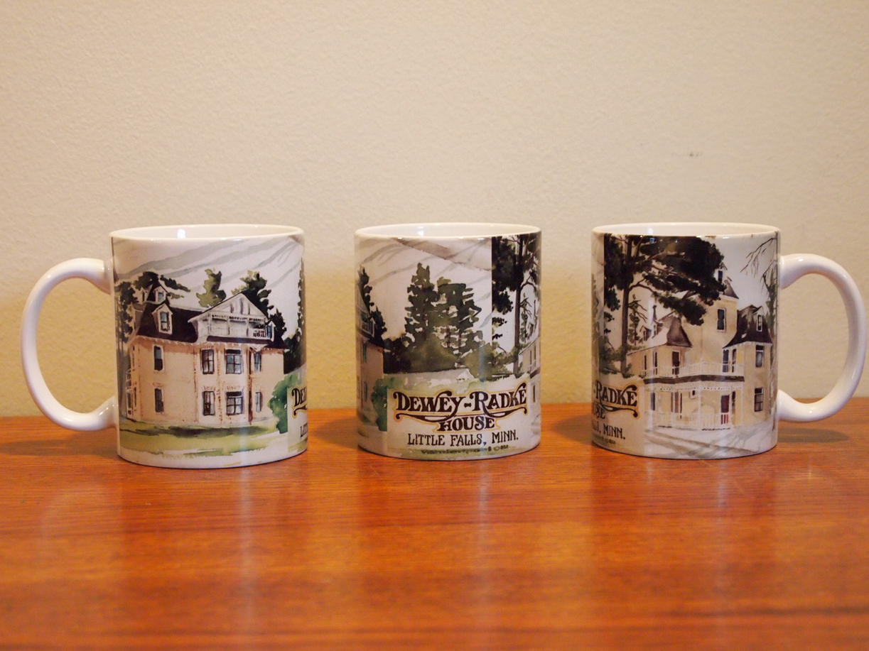 http://morrisoncountyhistory.org/museumpics/deweyradkemug1.jpg Dewey-Radke House mug, 3 views showing how the image wrap around the mug, 2011