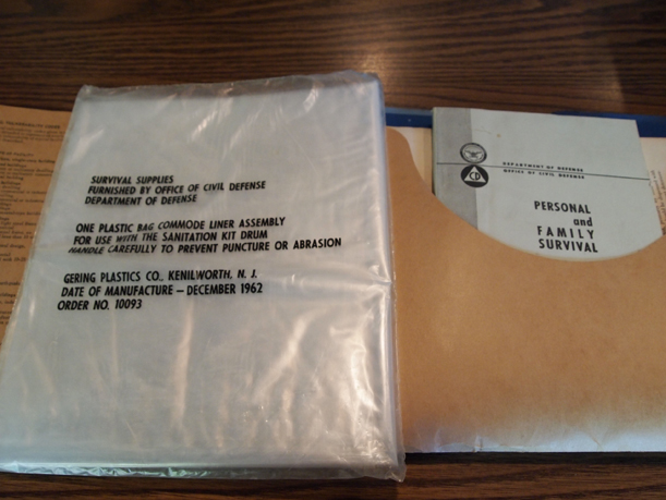Emergency booklets and commode liners in Fallout Shelter booklet, donated by the Little Falls Post Office to MCHS, June 26, 2015.