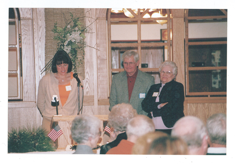 In 2005, the Morrison County Historical Society board presented Art and Jan Warner a commendation for their 40+ years of service to the organization. Board member Deb Collis (left) is presenting Art and Jan with the award during the organization's annual meeting at the Falls Ballroom, Little Falls, MN, October 15, 2005. #2006.16.14.