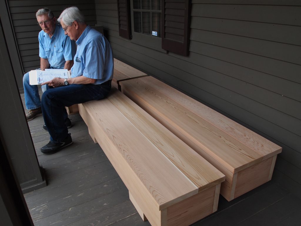 Art Warner reviewing an invoice with Bob Maschler concerning the new museum benches the men are sitting on, June 2012.