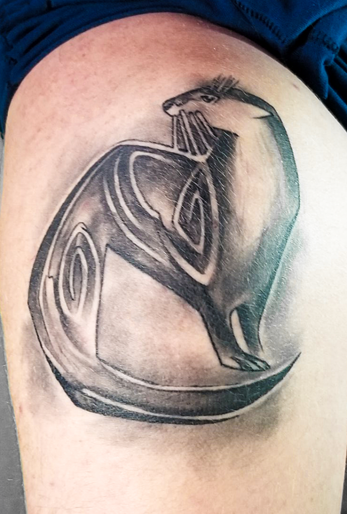Tattoo of an otter submitted by Eddie B. This is a visual representation of Eddie's nickname, "Otter." From The Story Behind the Tat: Tattoo Art in Central Minnesota, 2019.