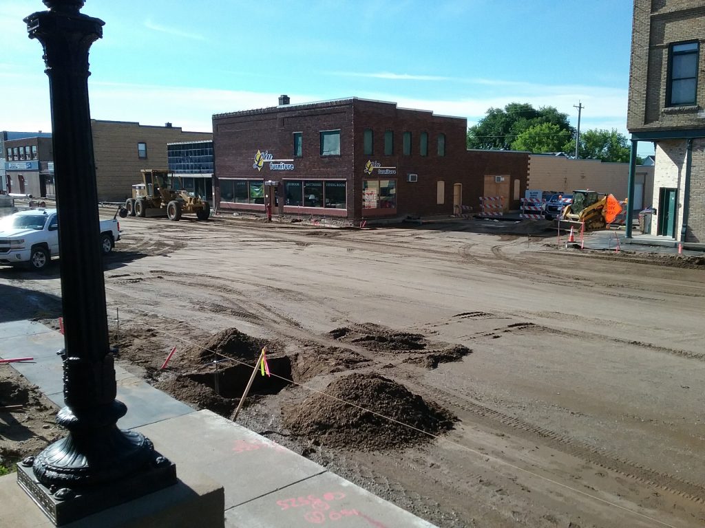 Road construction on Broadway in front of Post Office, Little Falls, MN, July 2, 2019. Progress is being made! The Post Office steps make a great vantage point for seeing a section of the road construction.