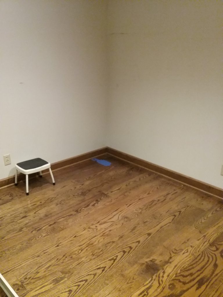 Blue tape in southeast corner of Archives, prepping for drilling the first 2 holes, The Charles A. Weyerhaeuser Memorial Museum, 2019.