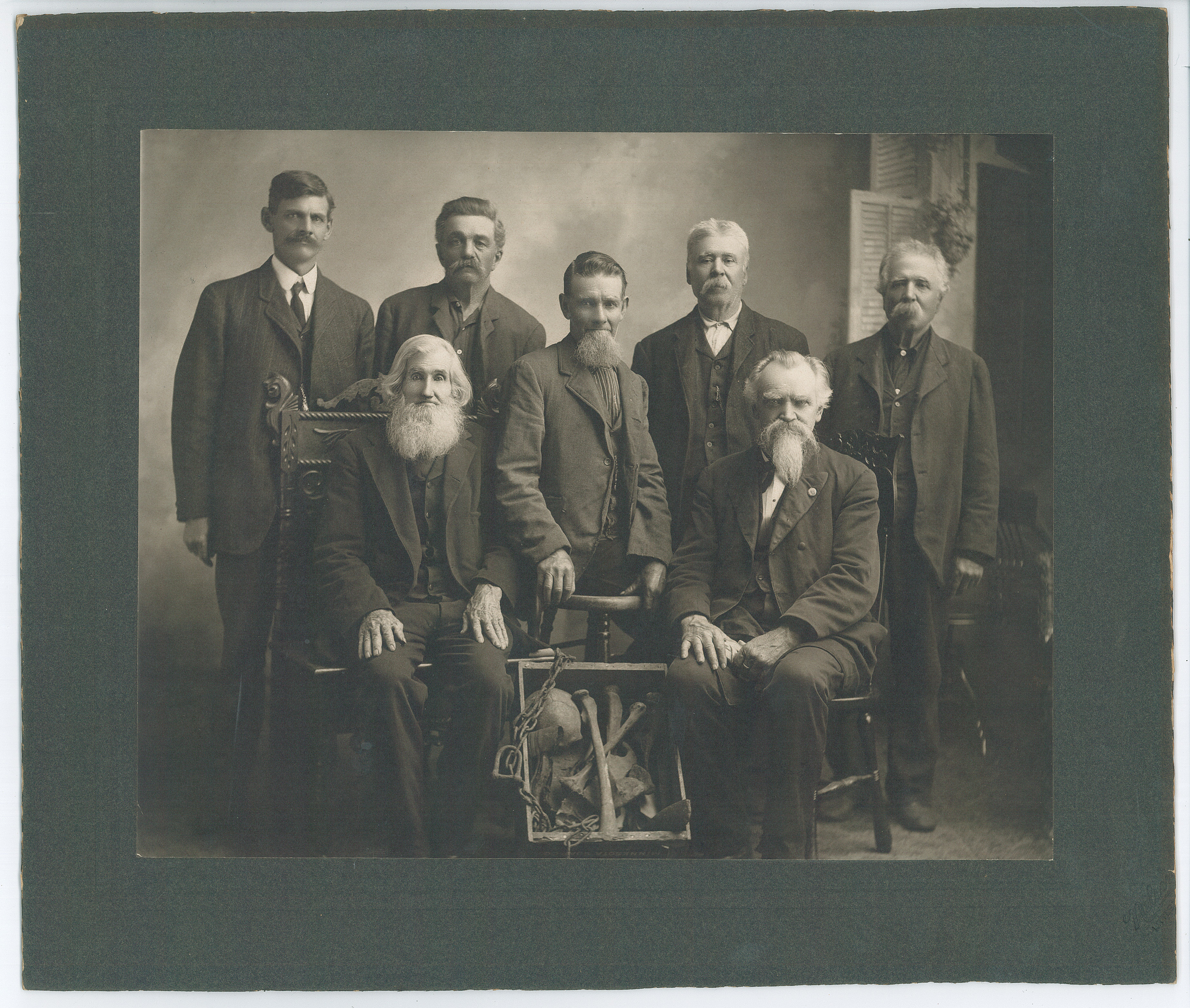 Some of the men who dug up the bones of the lynched Native Americans in June 1901. Standing from left: Charles Simmons, Frank Dufort, Sr., James Tanner, Joseph Boisjoli, Leon Boisjoli. Seated: William Nicholson (left), Nathan Richardson (right). Photo c. 1902. #1945.49.1.