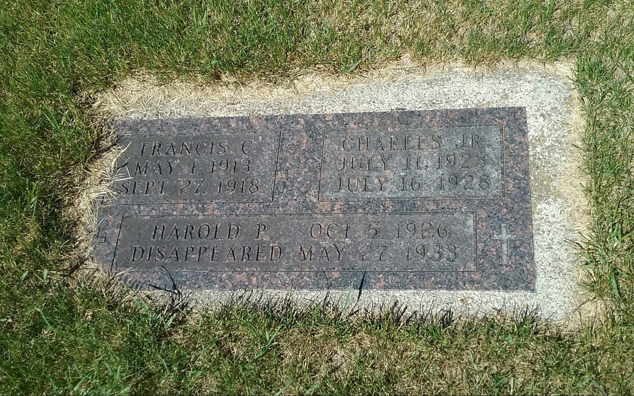 Grave marker for Frances C. and Charles Tidd, Jr., with a memorial to Harold P. Tidd, who disappeared May 27, 1933, located in Calvary Cemetery, Little Falls, MN. Photo by Mary Warner, 2017.