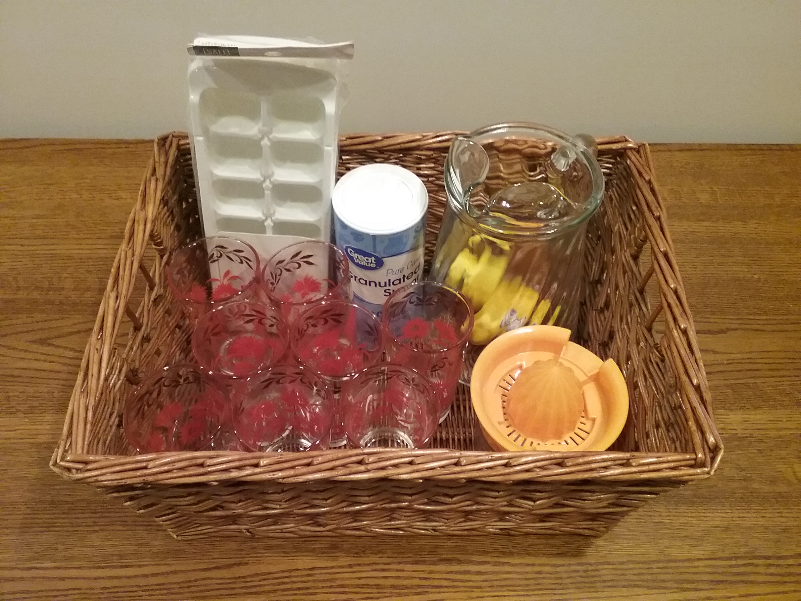 MCHS Silent Auction Item: Lemonade-making basket including a pitcher and 8 vintage Hazel Atlas "red carnation" glasses.