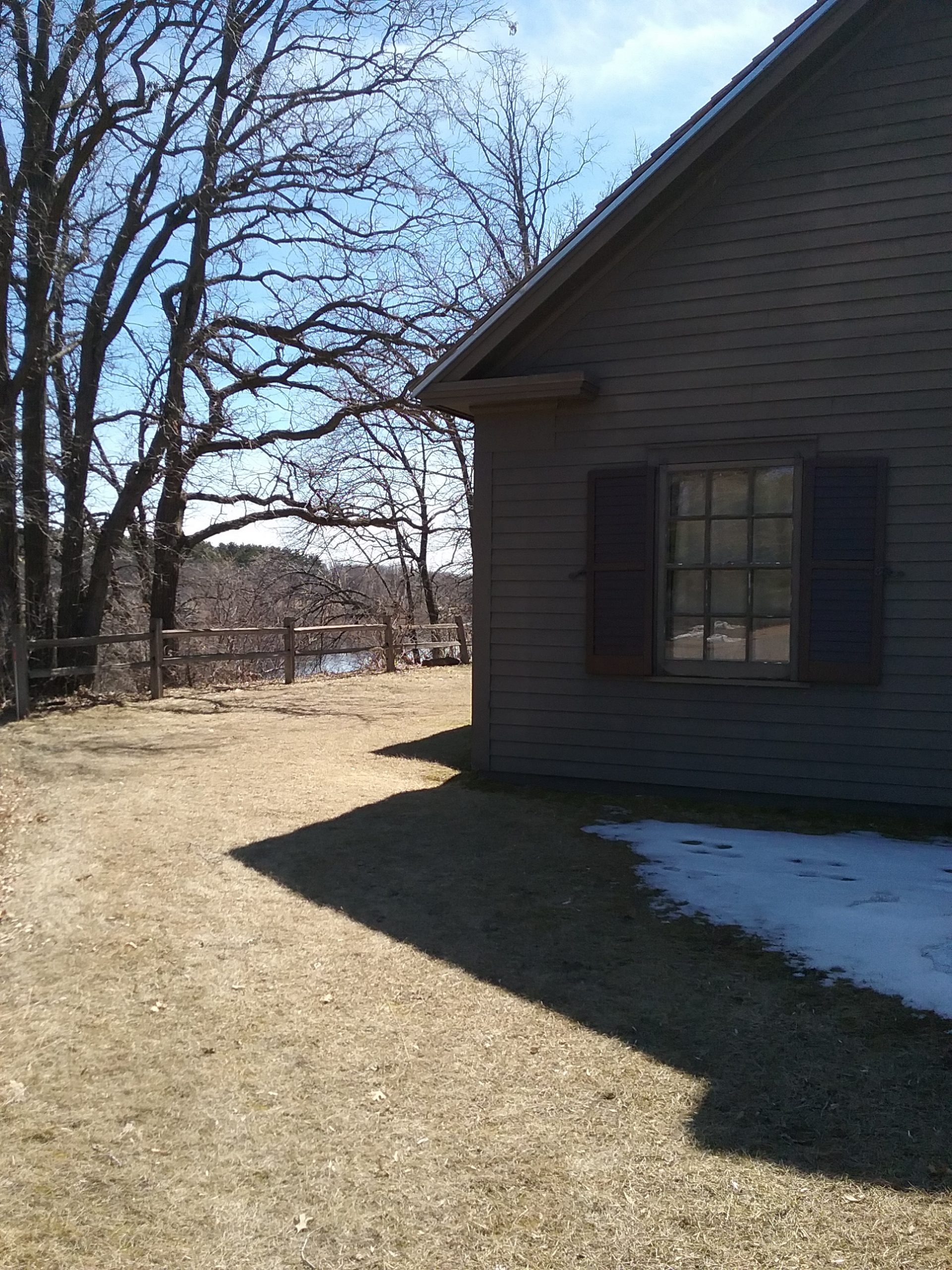 This photo shows the relationship of the Weyerhaeuser Museum to the fence at the closest point - approximately 20 feet between building and fence. Photo taken April 16, 2019.