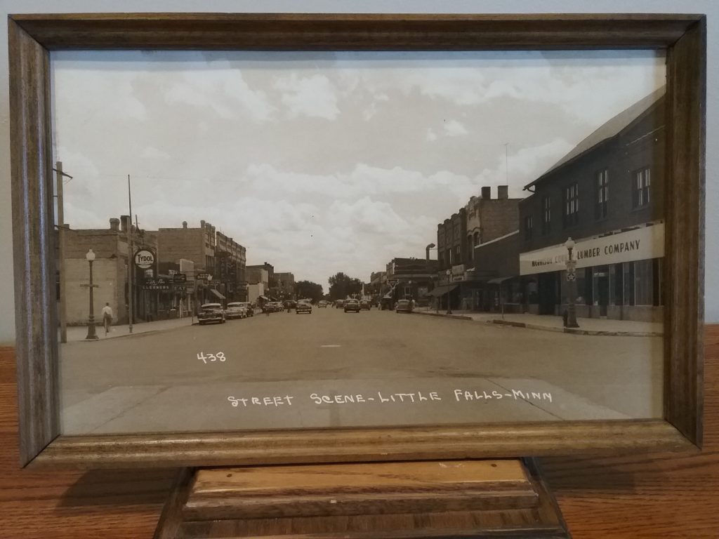 Framed, enlarged photo of First Street Northeast, downtown Little Falls, c. 1948, donated by U.S. Bank.