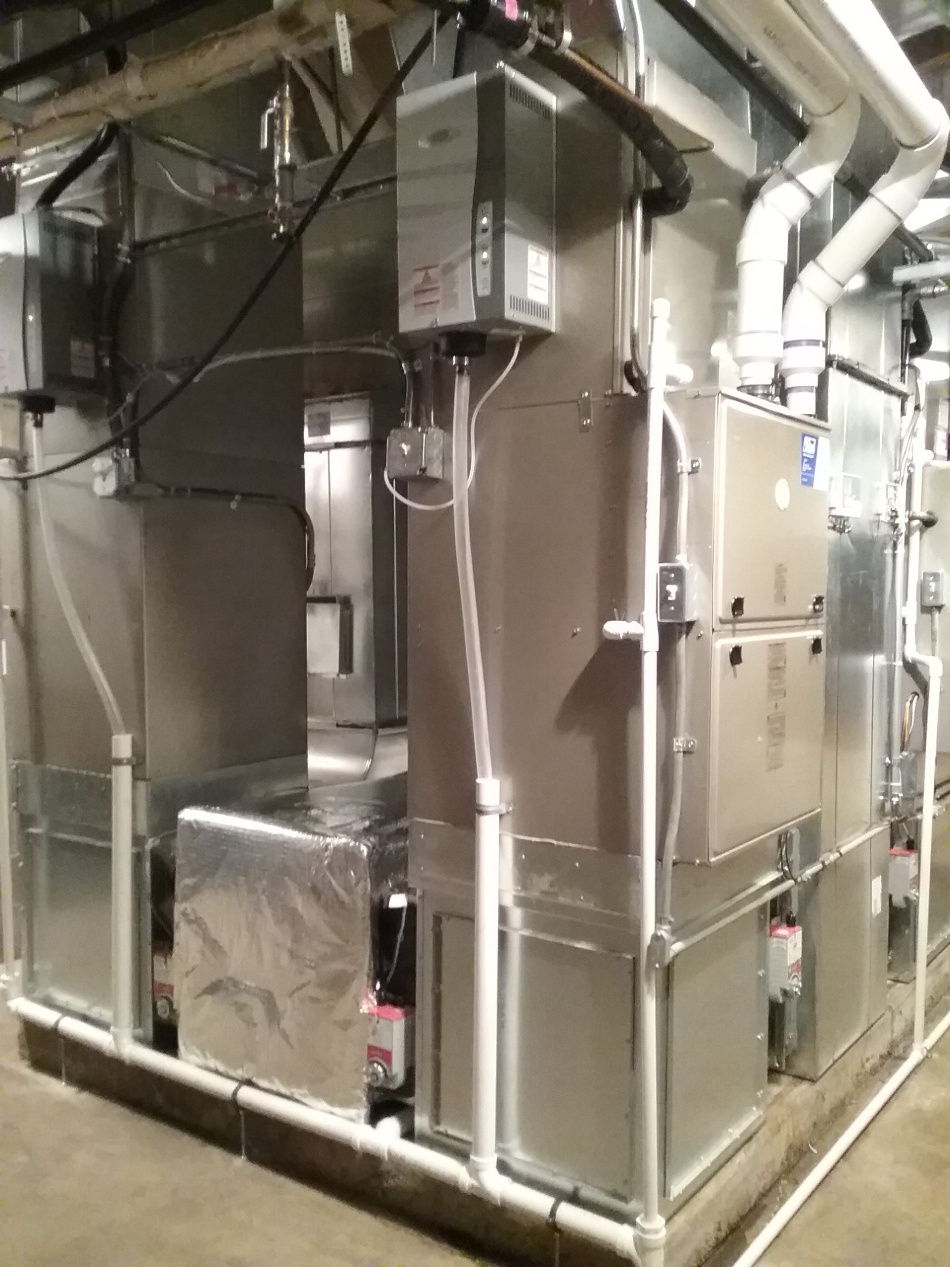New high-efficiency gas furnaces in the furnace room of The Charles A. Weyerhaeuser Memorial Museum, Little Falls, MN, December 1, 2021.